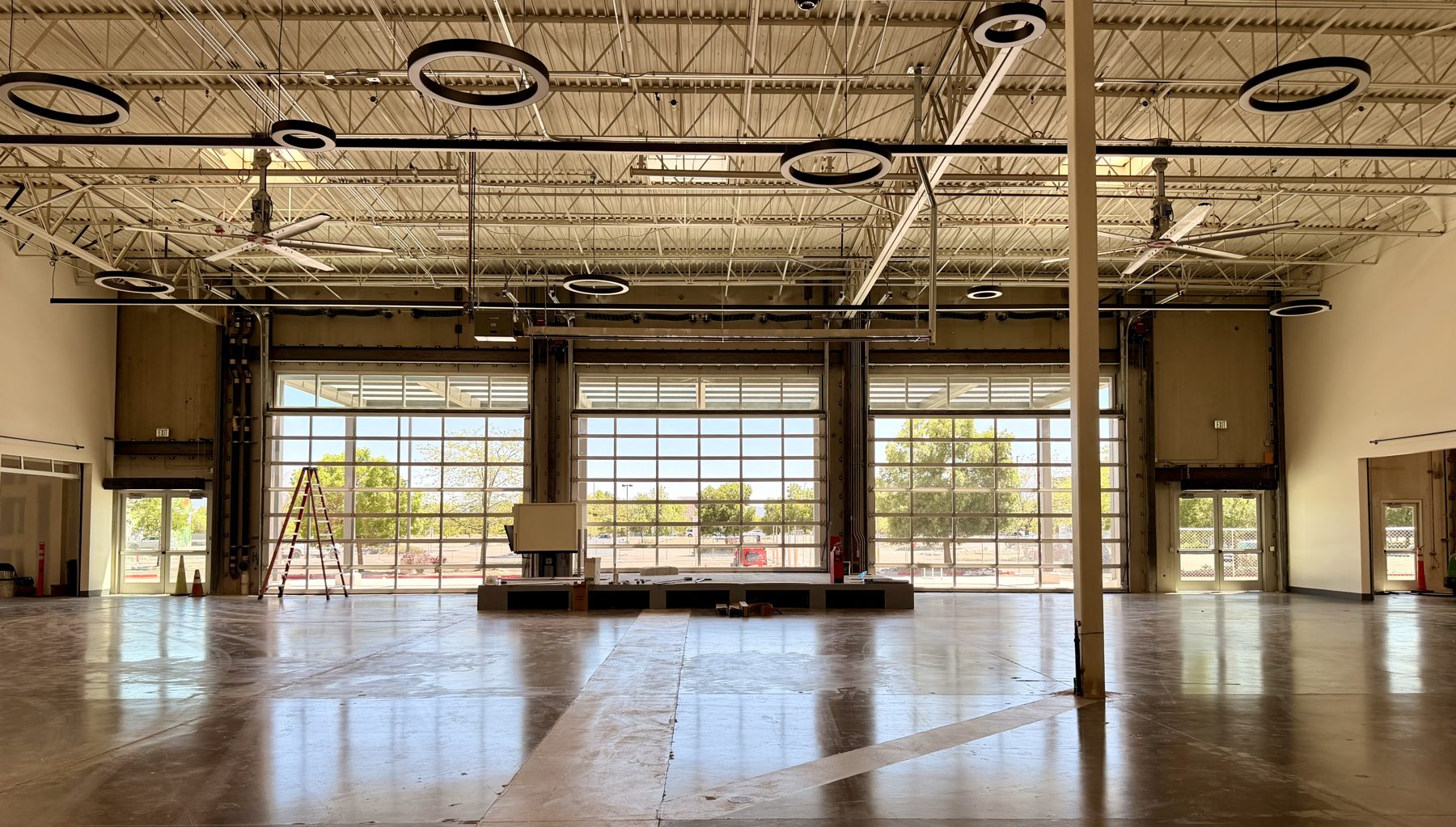 Now: the Oddie Commons stage, ring lights and glass garage doors